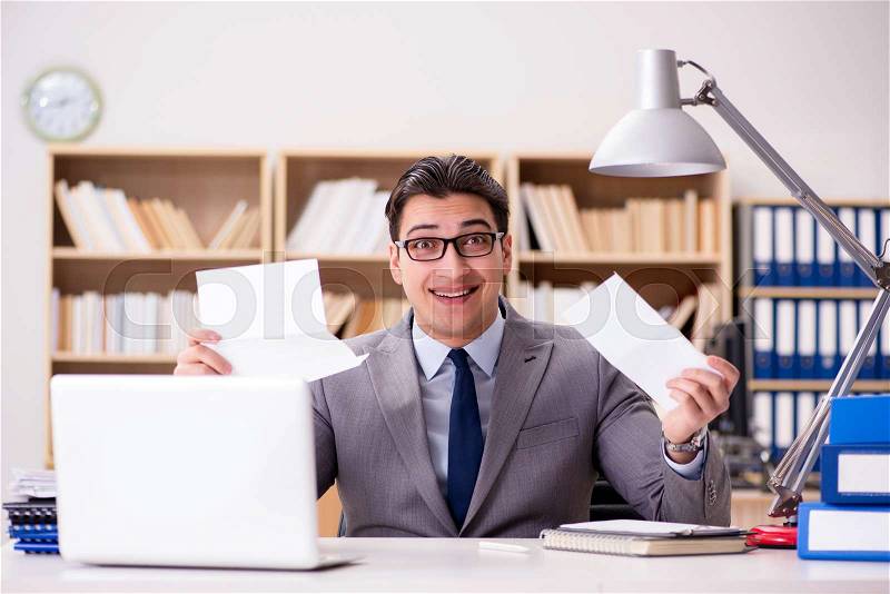 The businessman receiving letter in the office, stock photo
