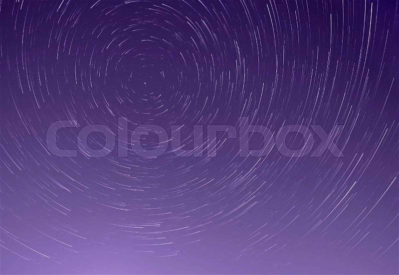 Trails of stars in night sky, stock photo