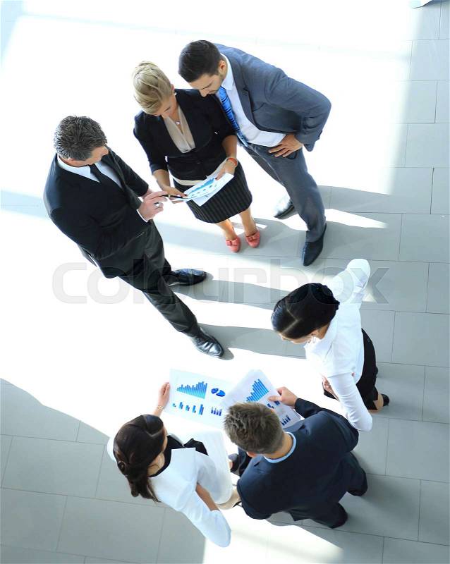Business seminar where a boss explaining the company strategy to his colleagues, stock photo