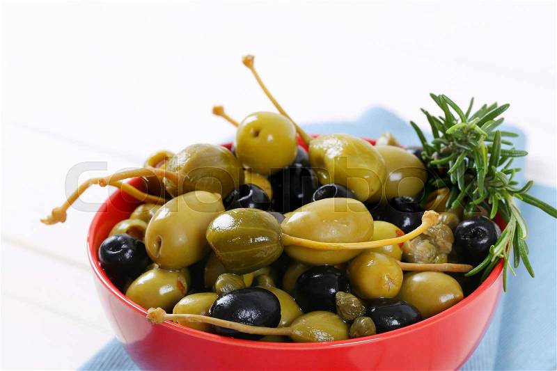 Green and black olives with capers and caper berries, stock photo