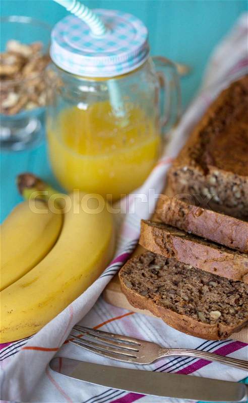 Healthy eating. Banana bread, bananas and orange juice on the table , stock photo