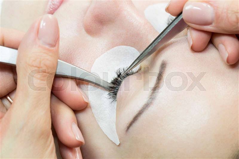The process of eyelash extensions in the beauty salon, stock photo
