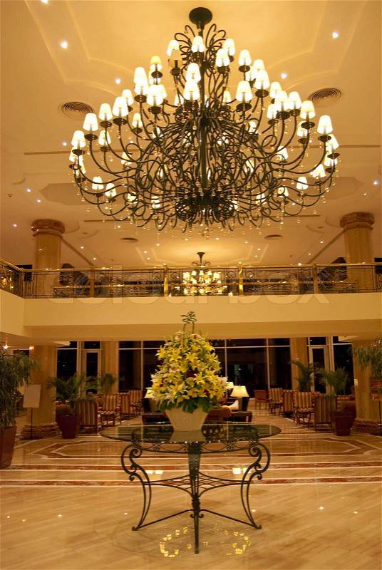 Hotel foyer. Elegant design wtih table, flowers, chandelier and bar, stock photo