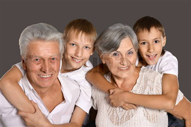 Portrait of a happy grandparents with their grandchildren, stock photo