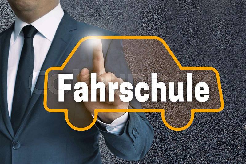 Fahrschule (in german Driving school) auto touchscreen is operated by man concept, stock photo