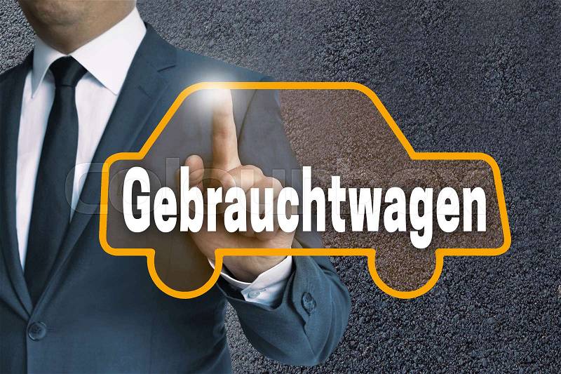 Gebrauchtwagen (in german Used car) auto touchscreen is operated by man concept, stock photo