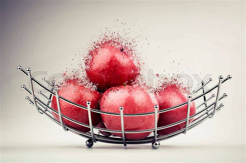 Modern style fruit basket made of steel wire with red apple exploded, stock photo