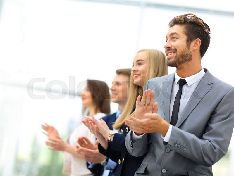 Satisfied proud business team clapping hands, stock photo