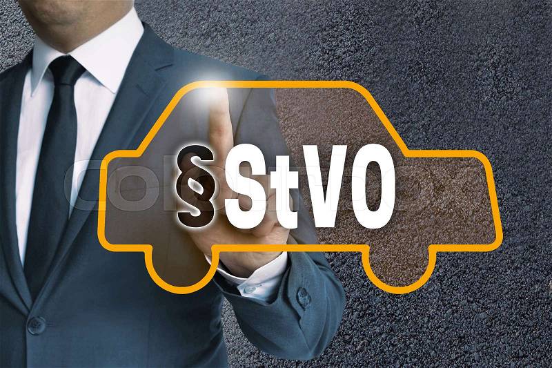 StVO auto touchscreen is operated by businessman concept, stock photo