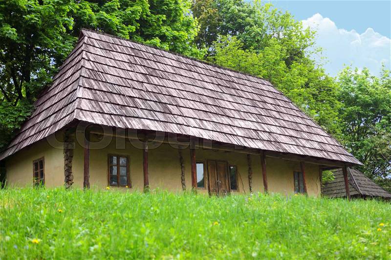 The old wooden house located on the fringe of the forest, stock photo