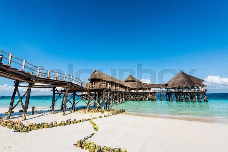 Colorful landscape with african hotel in sea on the pier, Zanzibar, stock photo