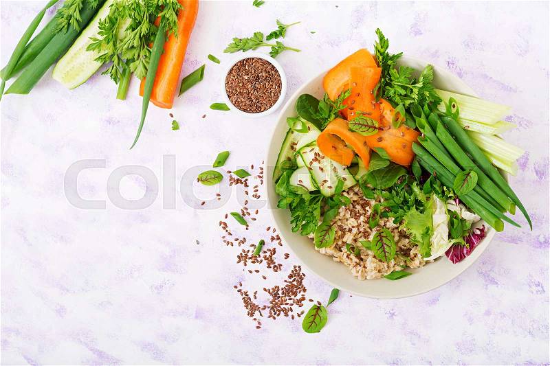 Diet menu. Healthy lifestyle. Oat porridge and fresh vegetables - celery, spinach, cucumber, carrot and onion on plate. Flat lay. Top view, stock photo