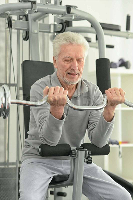 Portrait of an elderly man in the gym, stock photo