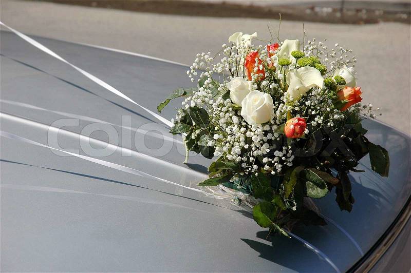 Wedding decorations - flowers on the hood of the car, stock photo