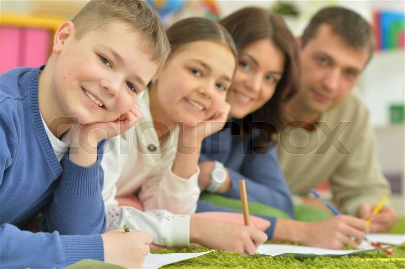 Portrait of children draw with their parents, stock photo