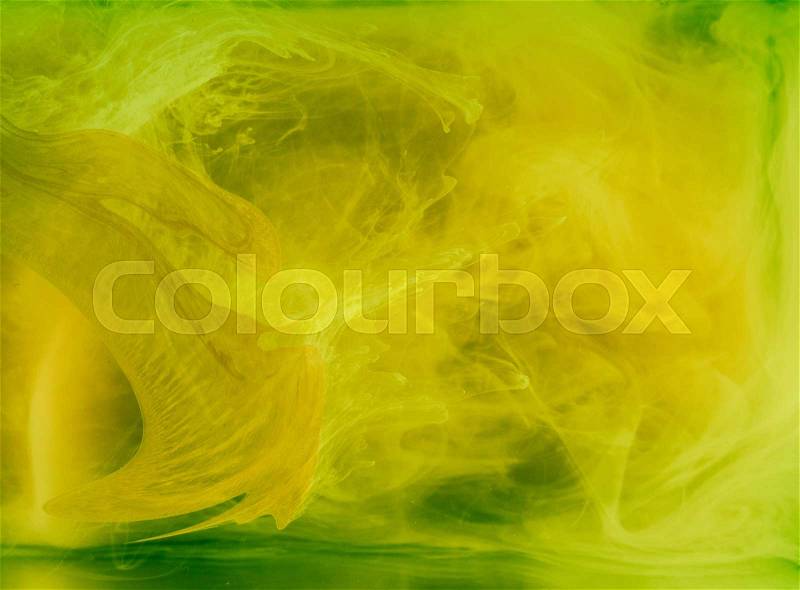 Abstract colored background. Yellow smoke, ink in water, the patterns of the universe. Abstract movement, frozen multicolor flow of paint. Horizontal photo with soft focus, blurred backdrop, stock photo
