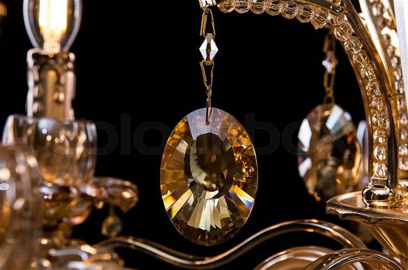 Contemporary glass chandelier isolated on black background. close-up chandelier. Crystal chandelier, stock photo