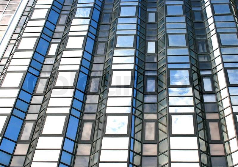High office building with clouds reflection on it, stock photo