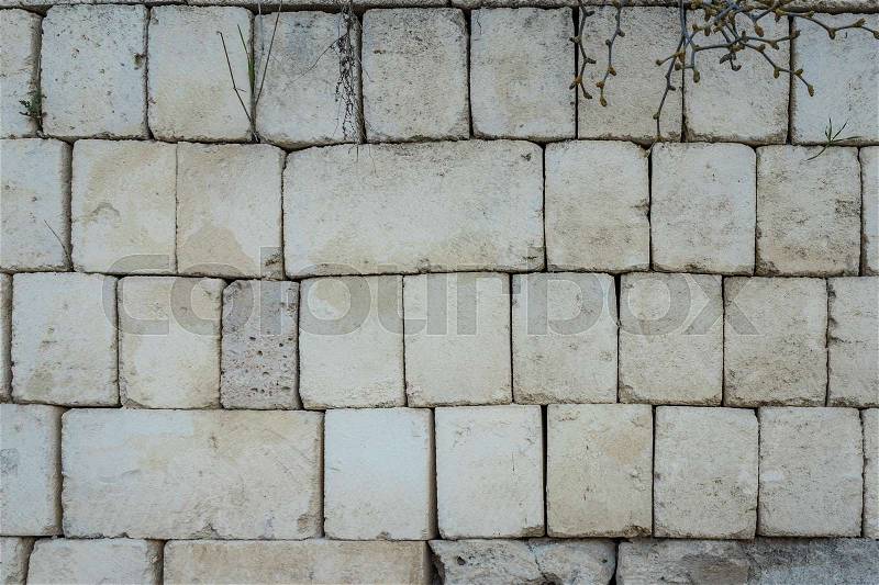 Ancient aged stone tiled texture as wall with copy space, stock photo