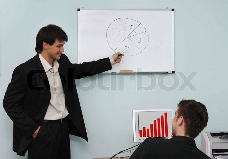 Two buisnessmen discussing the growth diagram on a meeting, stock photo