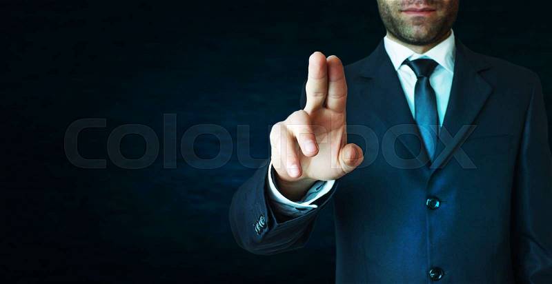 Businessman pointing finger. , stock photo