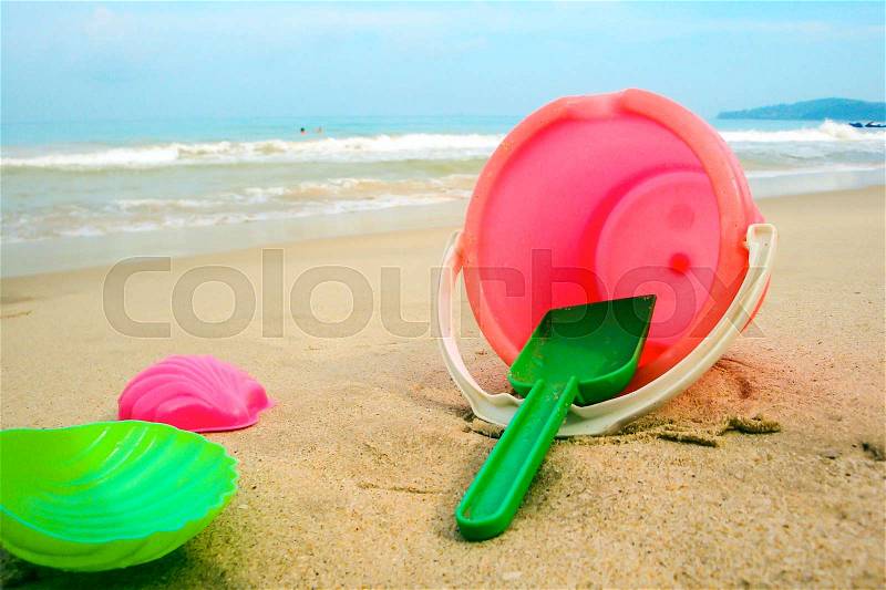 Children\'s pail and colored molds on the beach in the sand. Studio Photo, stock photo