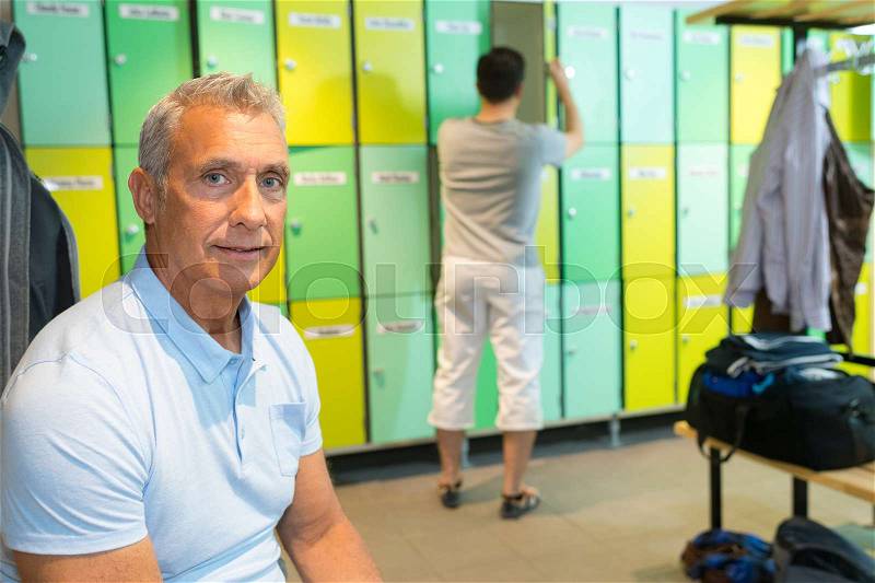 Portrait of senior man in locker room, stock photo