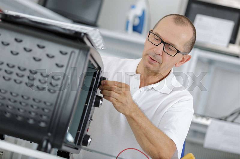 Industrial electronic technician, stock photo