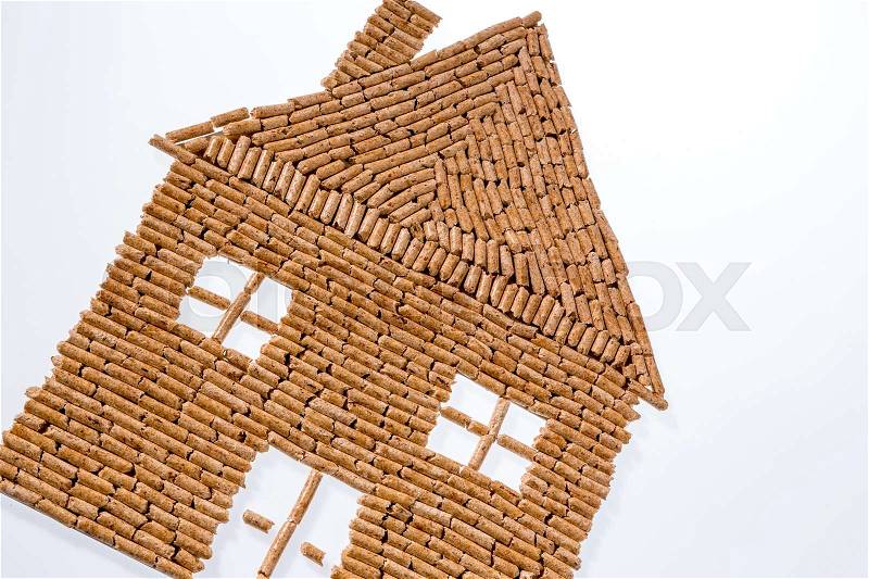 A house was built of pellets for heating. heating alternative and sustainable energy for, stock photo