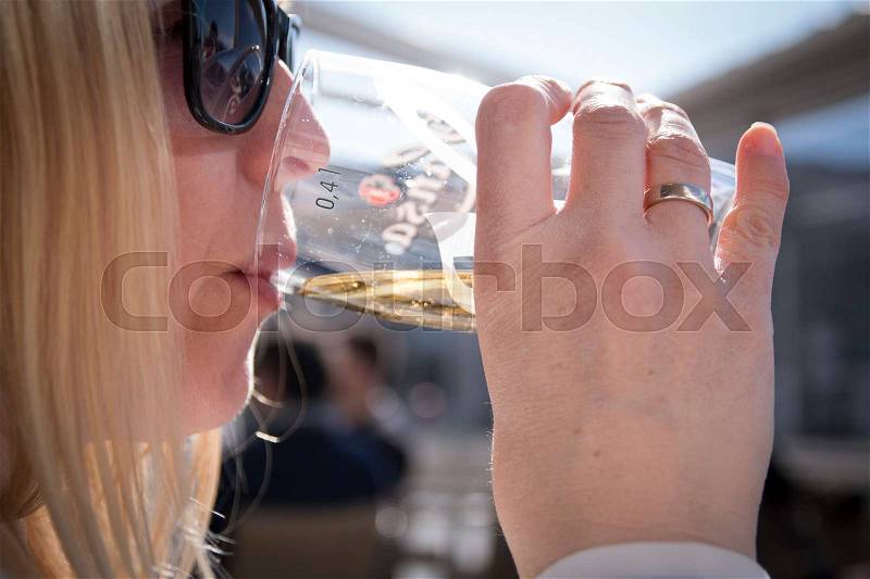 Female having a pint of lager, stock photo