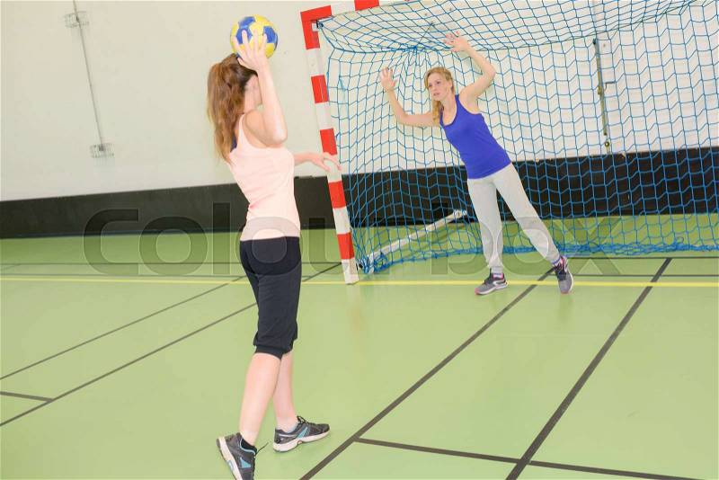 Women playing handball, stock photo