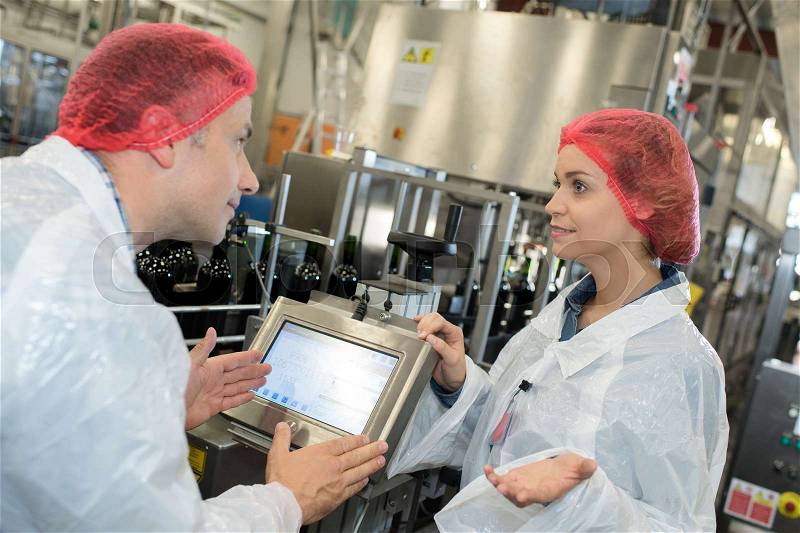 Two factory workers in disagreement, stock photo