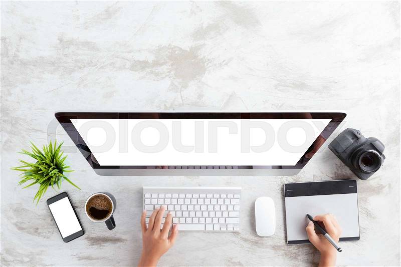 Top view of creative photographer using graphic tablet on work table, stock photo