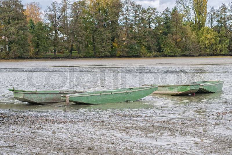 Green boats in a launched pond, stock photo