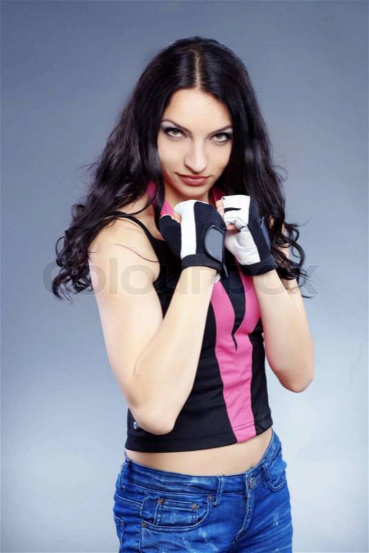 Portrait of young beautiful boxer woman, stock photo