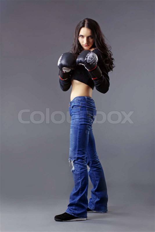 Portrait of young beautiful boxer woman, stock photo