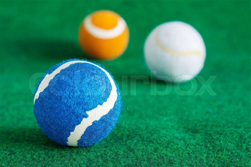 Colorful of tennis balls on the lawn, stock photo