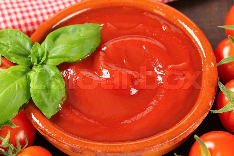 Bowl of smooth tomato puree, stock photo