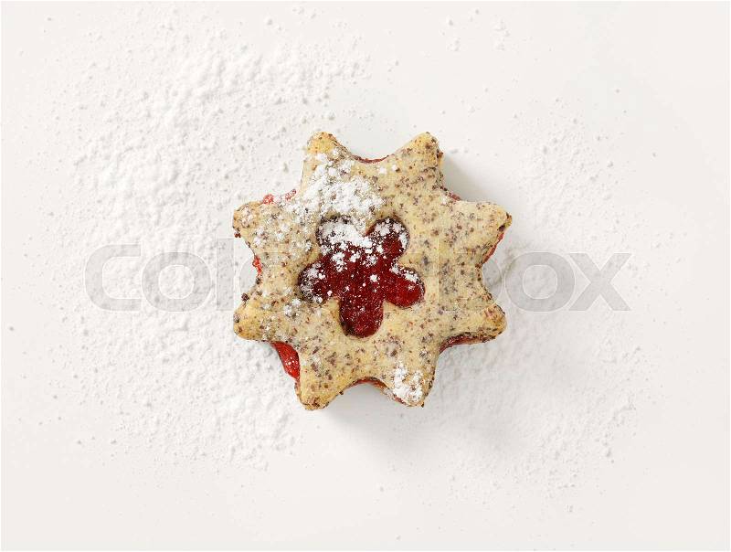 Shortbread cookie with jam filling on white background, stock photo
