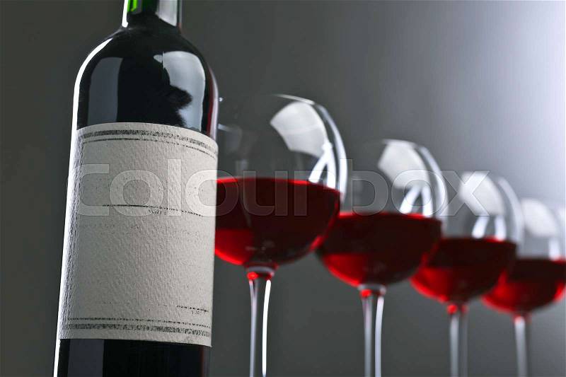 Bottle and glasses of red wine . Old paper label .Copy space , stock photo