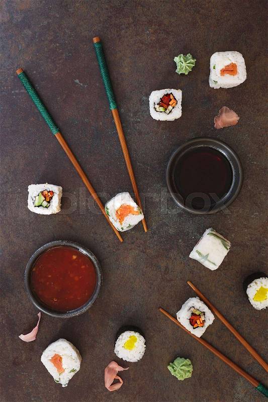 Sushi Food. Variety of vegetarian sushi roll, chopsticks, chili and soy sauce. Top view, blank space, stock photo
