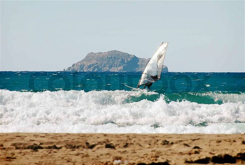 A wind surfer on the ocean, stock photo
