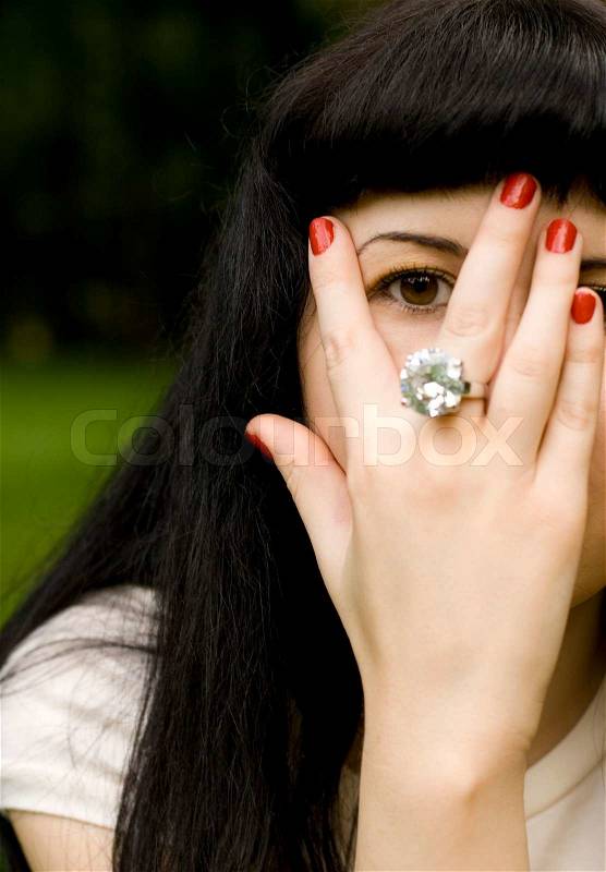 Girl covering her face, stock photo