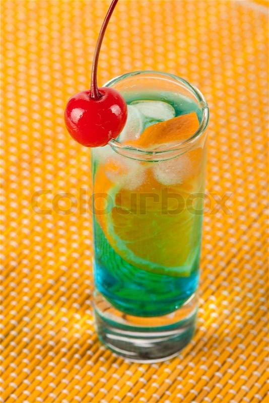 Alcohol cocktail with blue curacao and orange isolated on white background, stock photo