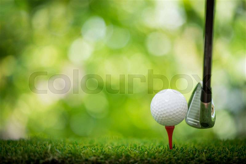 Tee off with golf club, stock photo