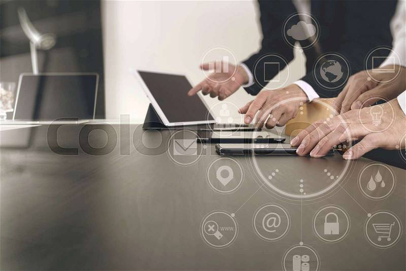 Co working team meeting concept,businessman using smart phone and digital tablet and laptop computer in modern office with virtual icon diagram, stock photo