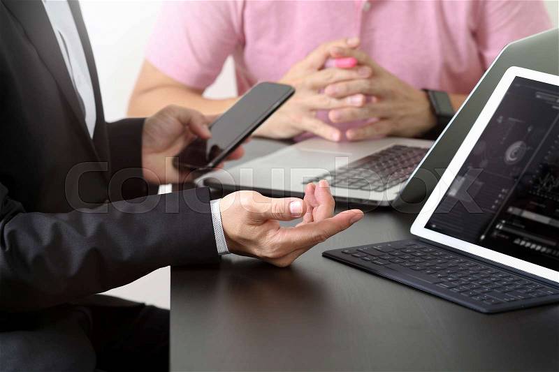 Co working team meeting concept,businessman using smart phone and digital tablet and laptop computer in modern office , stock photo