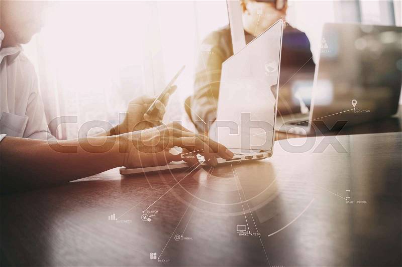 Co working team meeting concept,businessman using smart phone and digital tablet and laptop computer in modern office with virtual icon diagram , stock photo