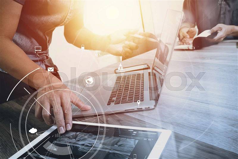 Co working team meeting concept,businessman using mobile phone and digital tablet and laptop computer in modern office with virtual icon diagram , stock photo