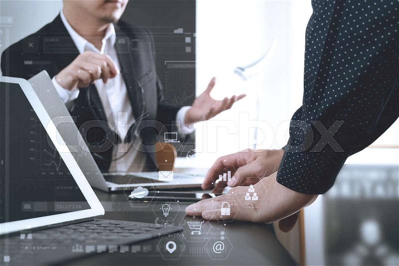 Co working team meeting concept,businessman using smart phone and digital tablet and laptop computer in modern office with virtual graph chart and icon diagram , stock photo